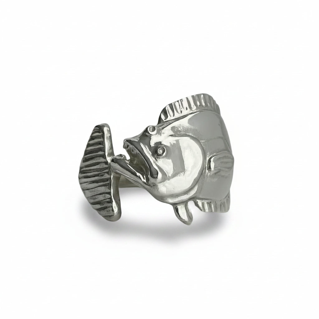 silver flounder ring on a light gray background
