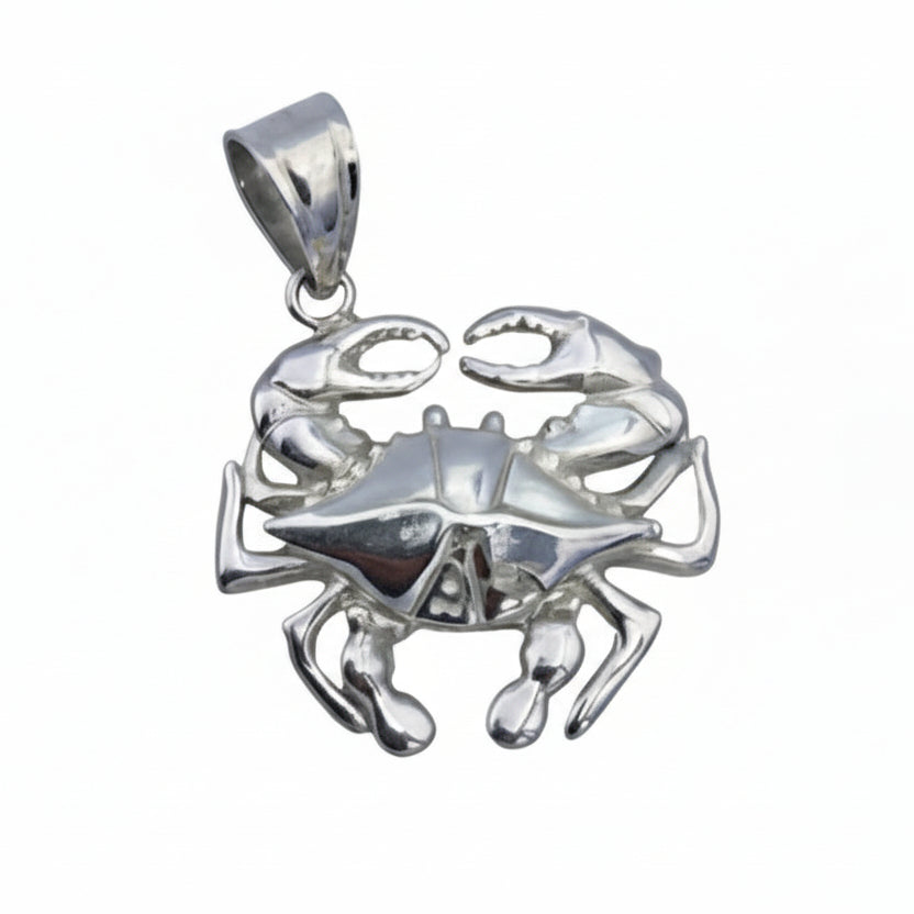 Silver crab pendant on a white background