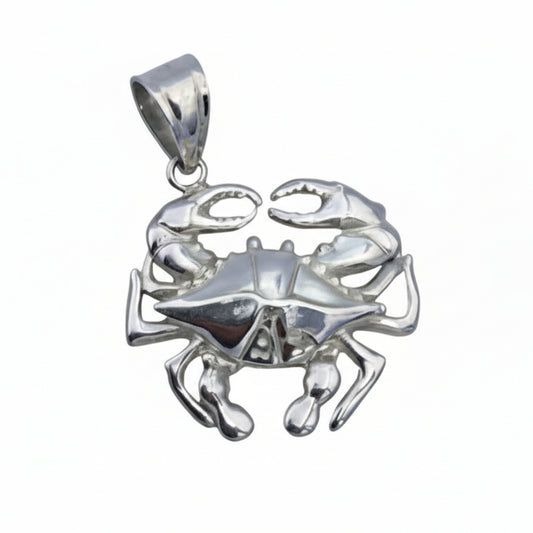 Silver crab pendant on a white background