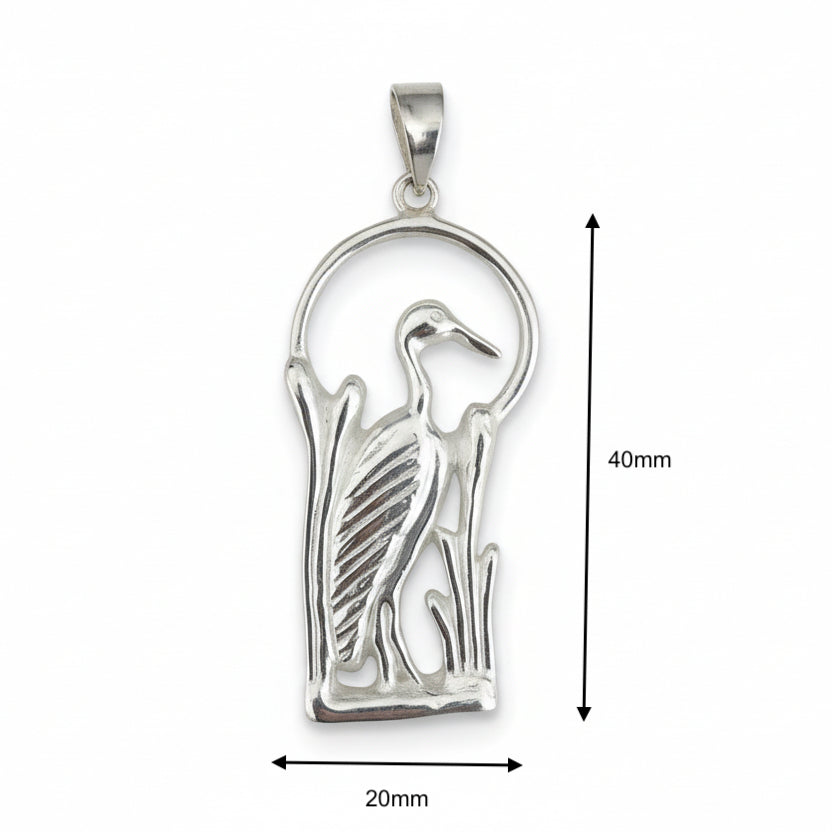 Silver pendant featuring a heron or crane silhouette standing among reeds inside an arch, shown with dimension markers indicating 40mm height and 20mm width on a white background.