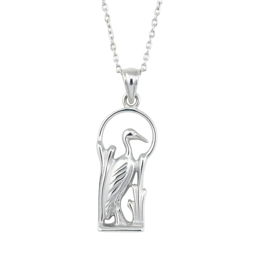 Silver heron pendant on a white background