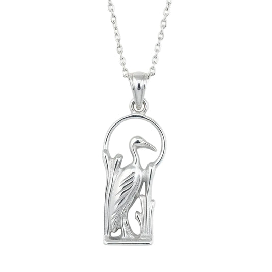 Silver heron pendant on a white background