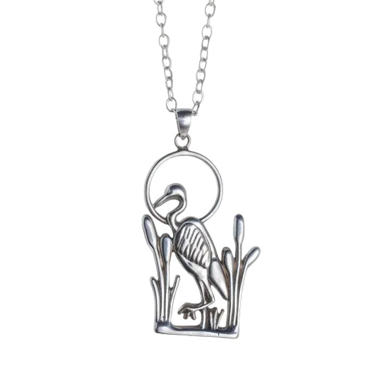 Silver blue heron leg up necklace on a gray background