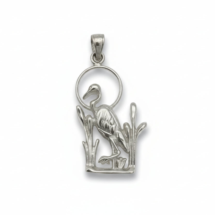 Silver pendant with a bird design on a white  background