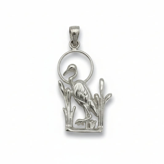 Silver pendant with a bird design on a white  background