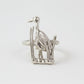 Silver heron ring on a light gray background