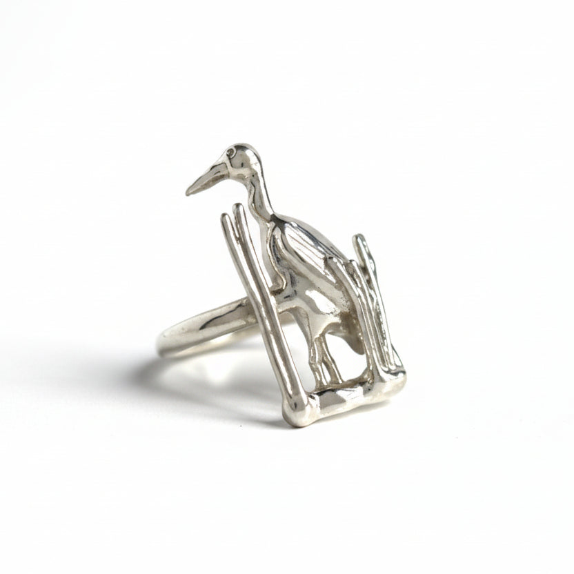 Silver Blue Heron ring  on a light gray background