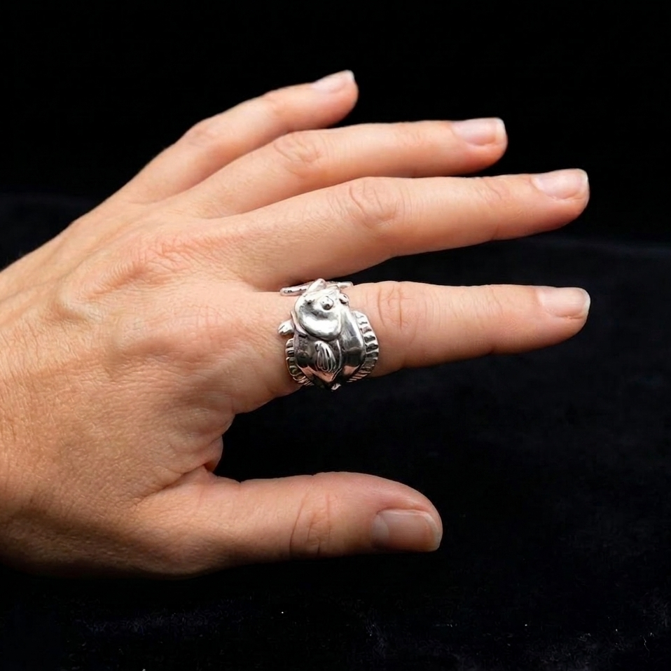 Silver Flounder Ring on lady model on black background 