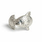 Silver fish-shaped tea infuser on a light gray background