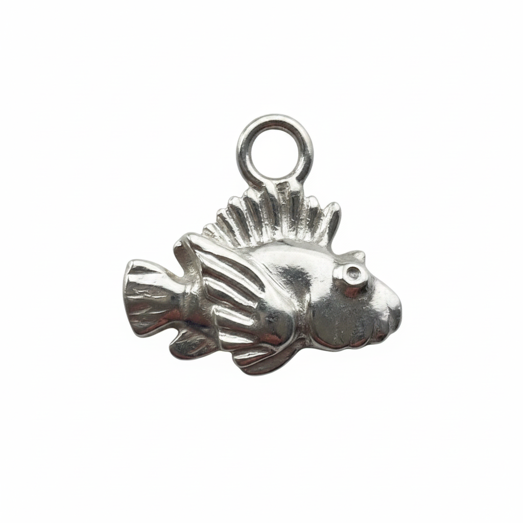 Silver fish charm on a white background