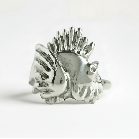Silver lionfish-shaped ring on a white background