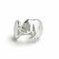 Silver manatee-shaped ring on a white background