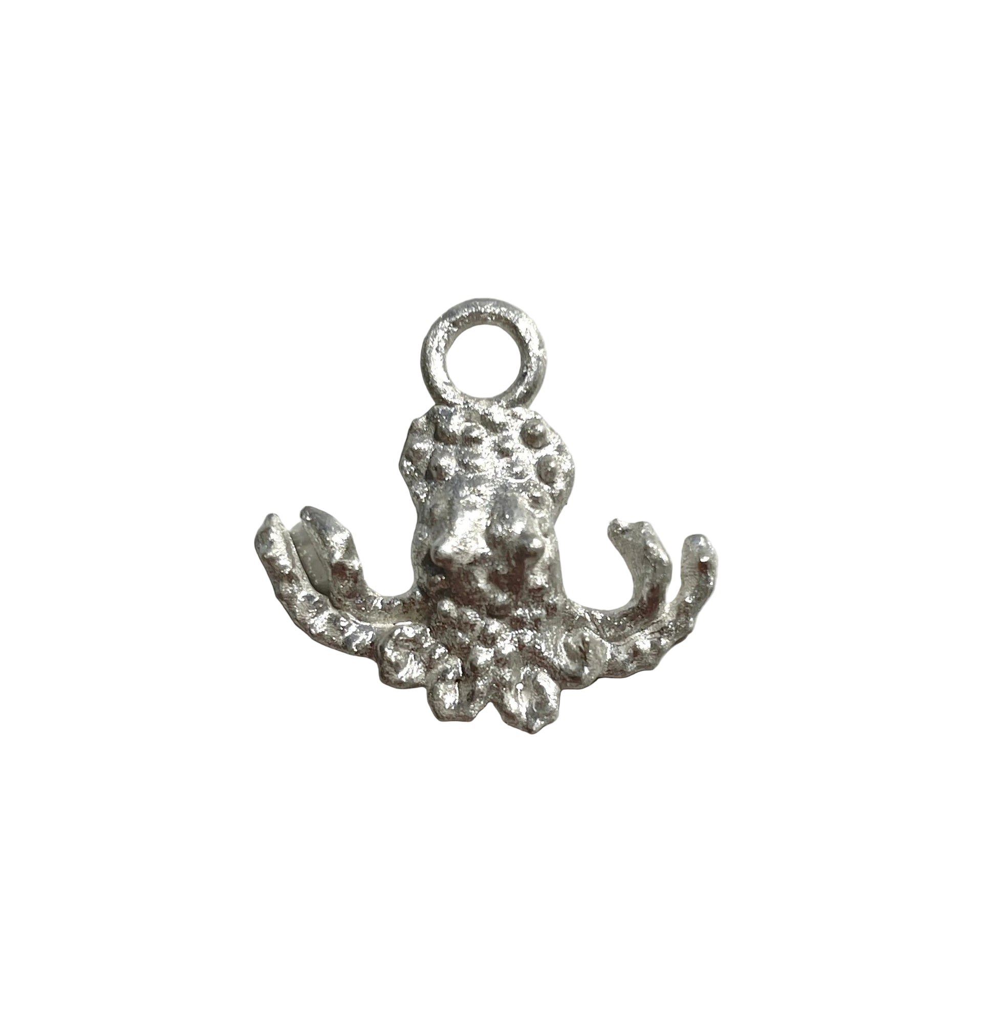 Silver octopus charm on a light gray background