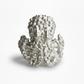 Silver octopus sculpture on a white background