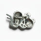 Silver octopus figurine charm on a plain background