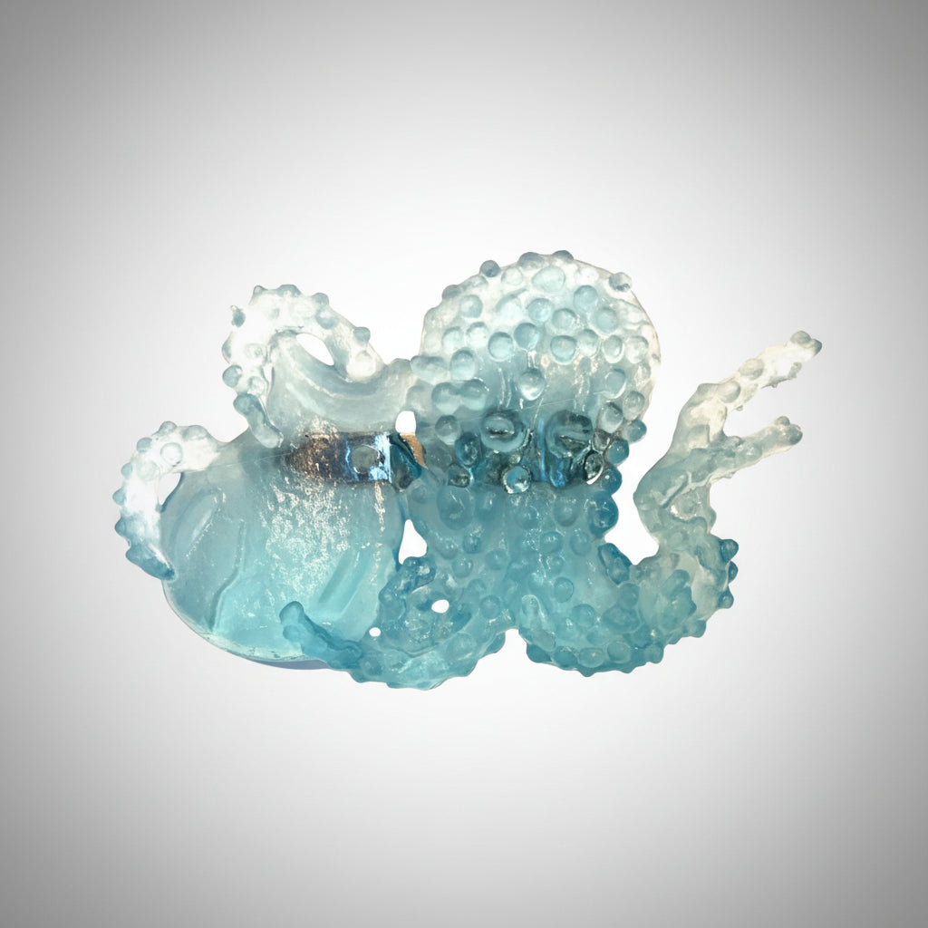 Translucent Blue octopus pin on white background