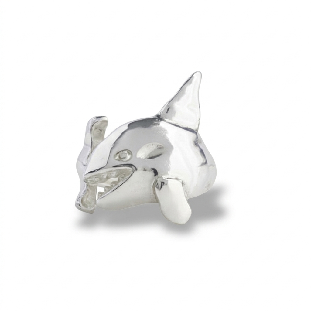 Silver shark-shaped ring on a white background