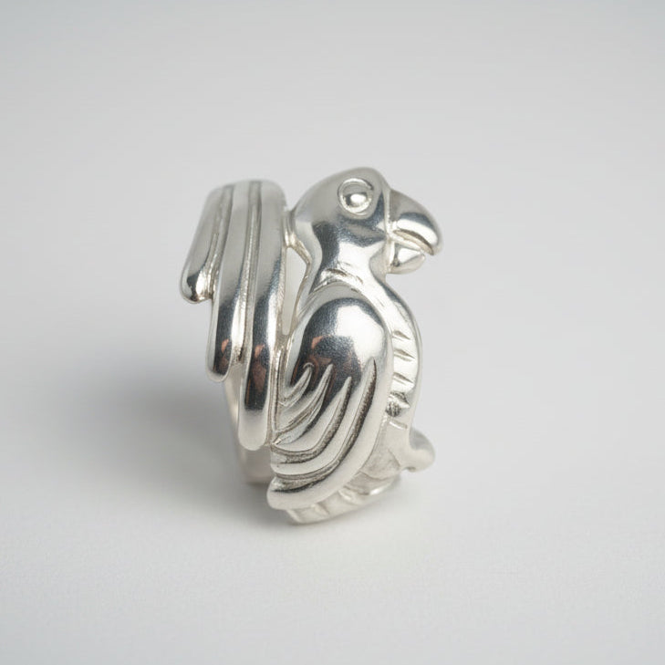 Silver Parrot-shaped object on a white background