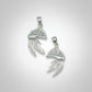 Two Portuguese Man O War-shaped pendants on a gray background
