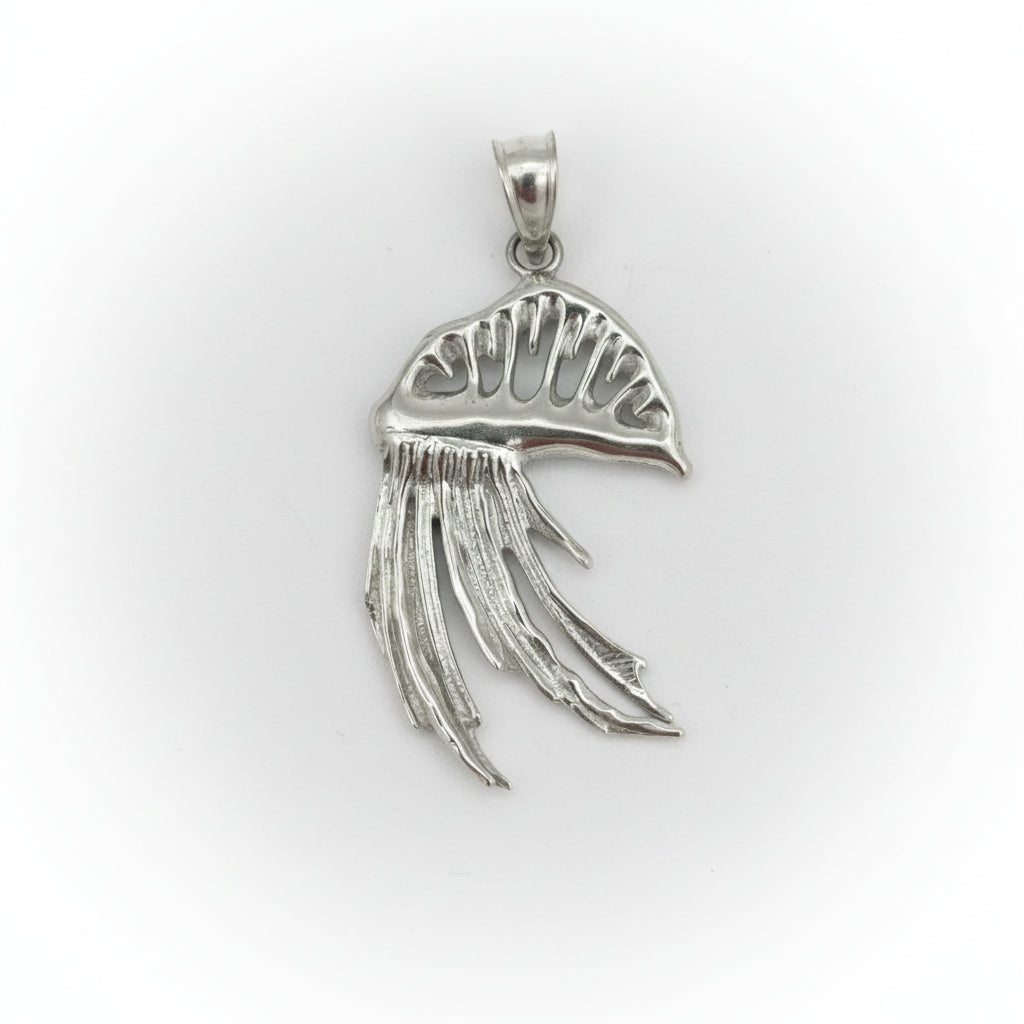 Silver pendant with Man o' war design on a gray background