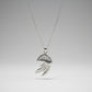 Silver Portuguese man o war necklace with a decorative pendant on a white surface