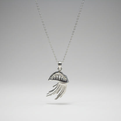 Silver Portuguese man o war necklace with a decorative pendant on a white surface