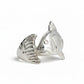 Silver fish-shaped object on a light gray background