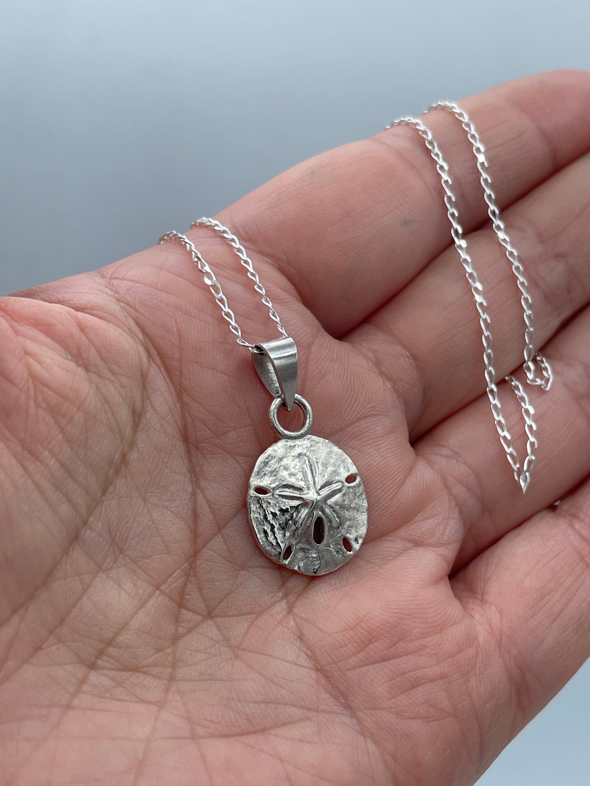Sand Dollar Charm on hand