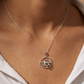 Turtle Silver necklace with a pendant worn by a person