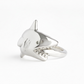 Silver shark-shaped ring on a white background