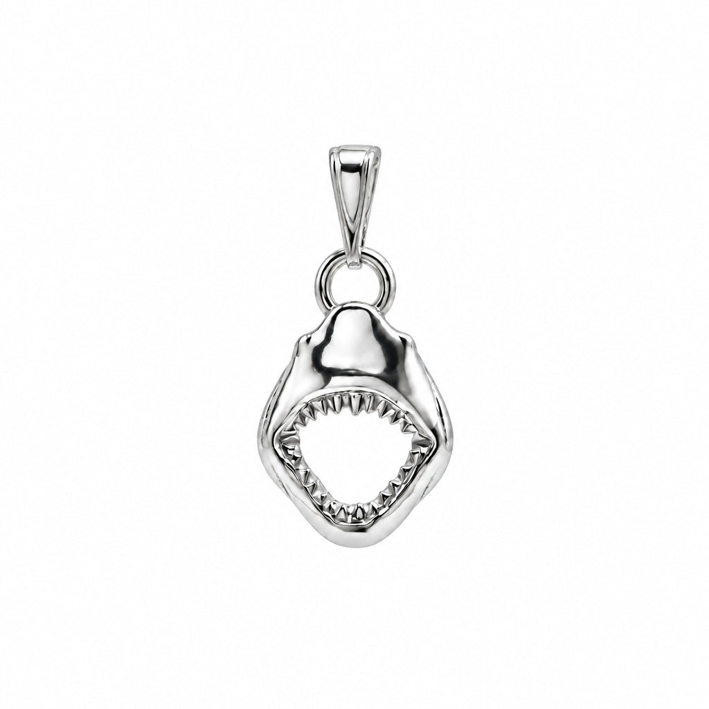 A polished silver pendant shaped like an open shark mouth with visible teeth, shown on a plain white background.