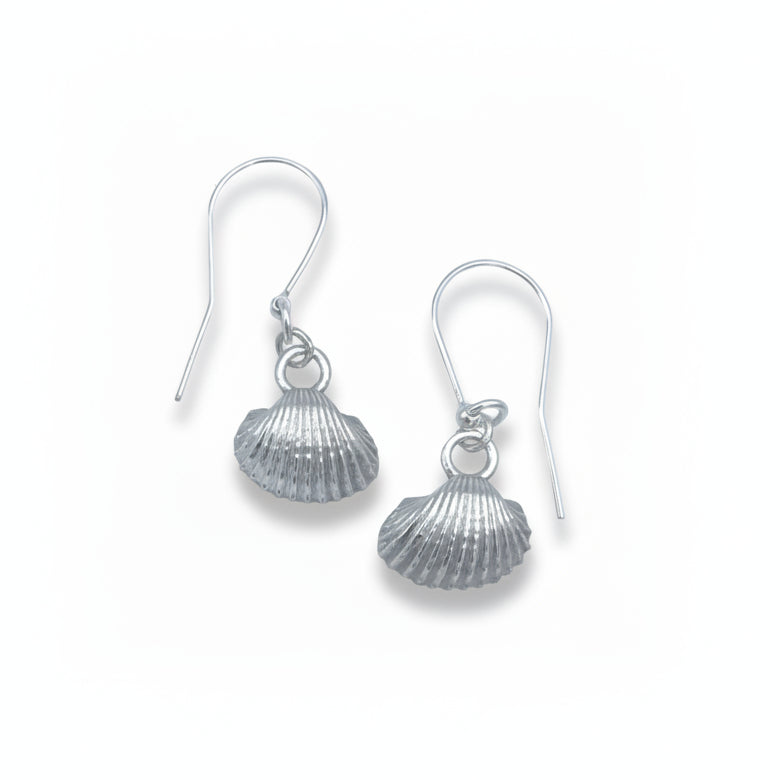 Silver shell pendant necklace and matching shell drop earrings displayed on white backgroud.