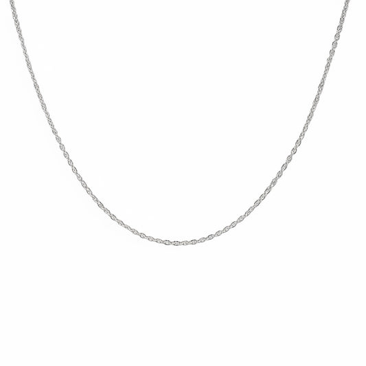 Silver chain necklace on a light gray background