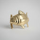 Gold tuna fish ring on a white background