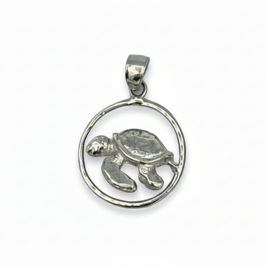 Silver turtle pendant on a white background