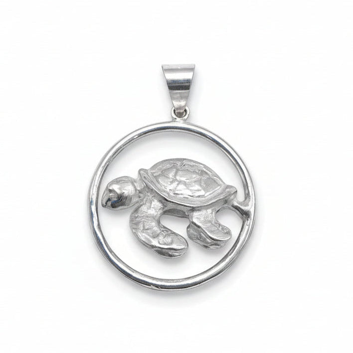 Silver turtle pendant on a white background