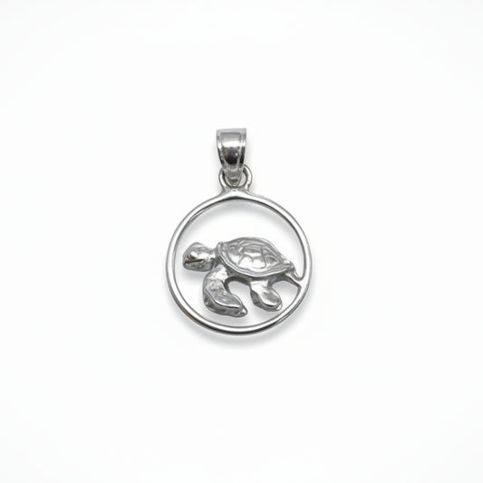Silver turtle pendant on a gray background